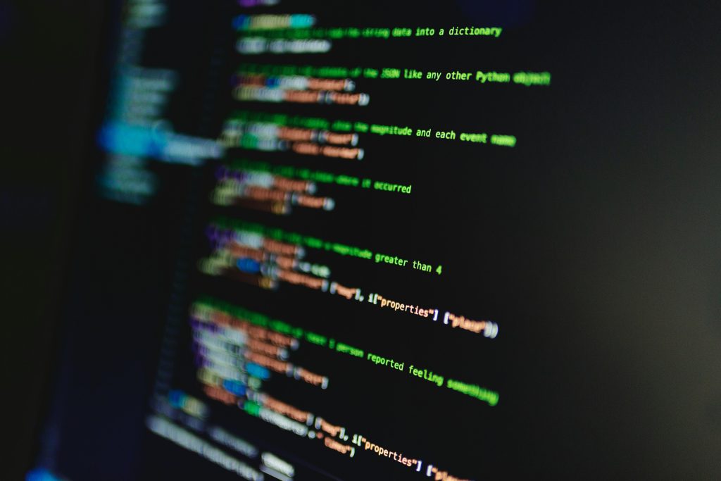 Blurry Photo of Lines of Code on Screen